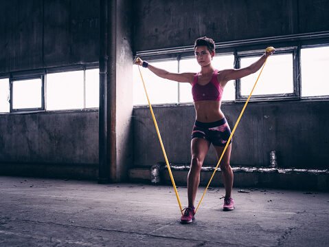 woman doing a resistance band workout