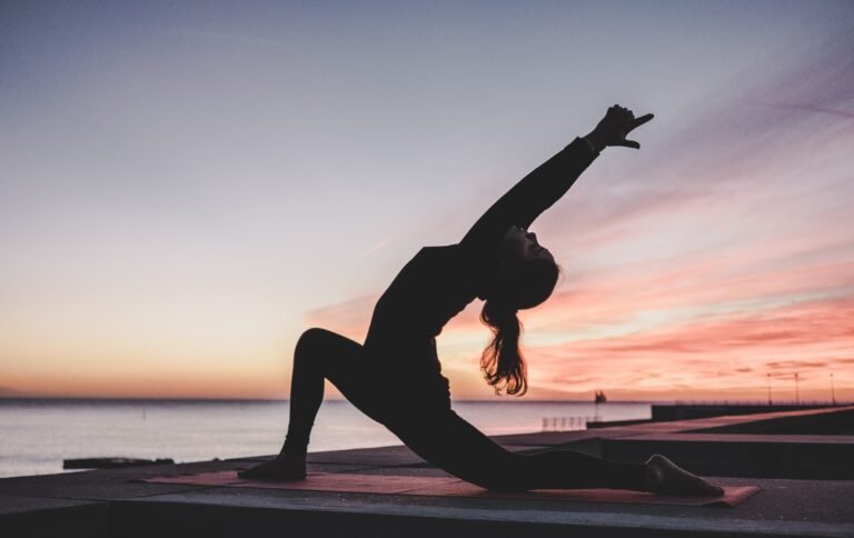 woman doing a yoga pose outside